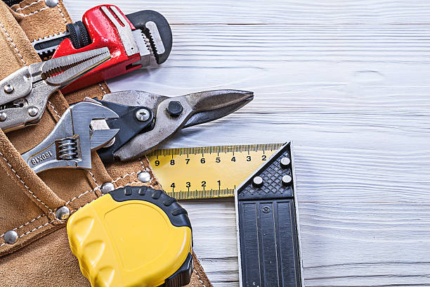 istock Construction tools in building belt on wooden board maintenance 545427626