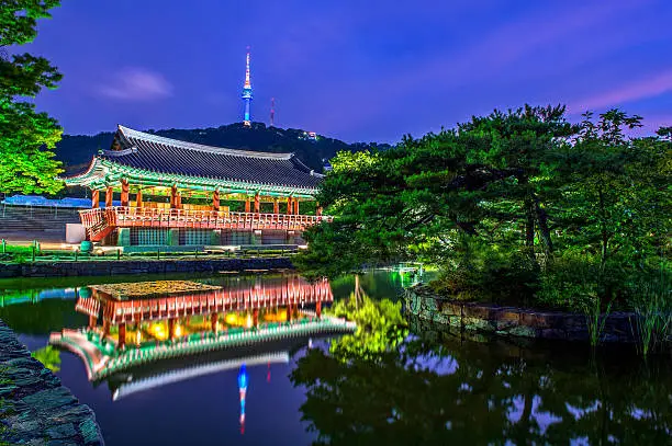 Namsangol Hannok Village and Seoul Tower Located on Namsan Mountain at night in Seoul,South Korea.