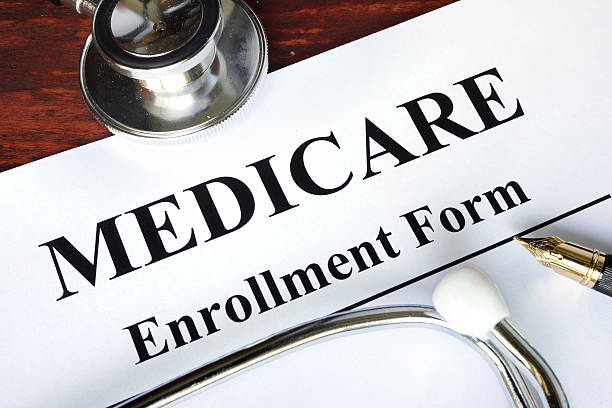 istock Medicare enrollment form written on a paper. 545428026