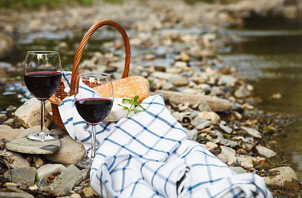 istock Red wine, cheese and bread served at a picnic 545430580
