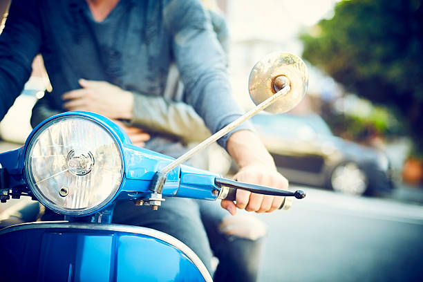 istock Blue retro scooter ridden by couple 545430636