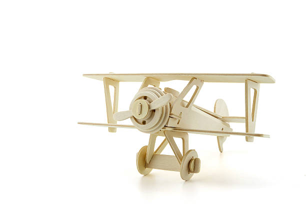 istock Wood airplane isolated on white with clipping path 545430938