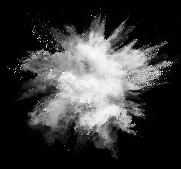 White powder explosion on black background stock photo