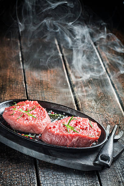 istock Fresh piece of beef with herbs for roasting 545432658