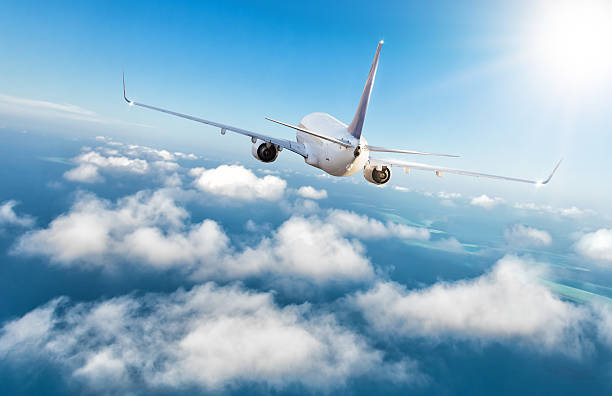 istock Commercial jet plane flying above clouds 545433830