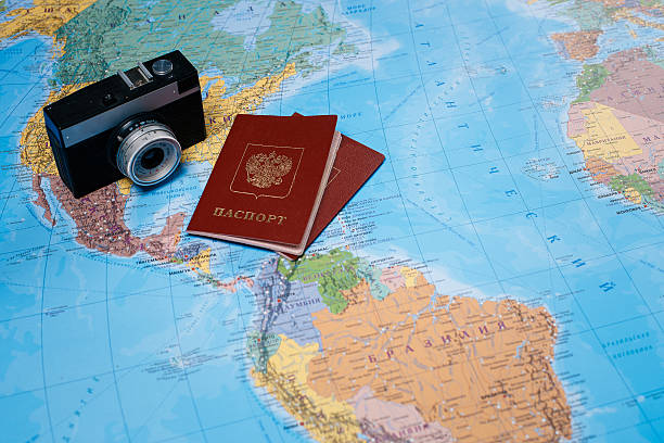 istock Passports and things lying on the world map 545434020