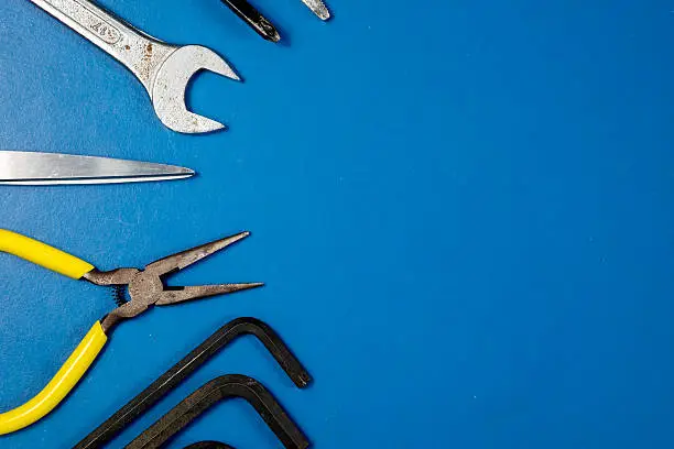 Photo of Tools on blue table for background.