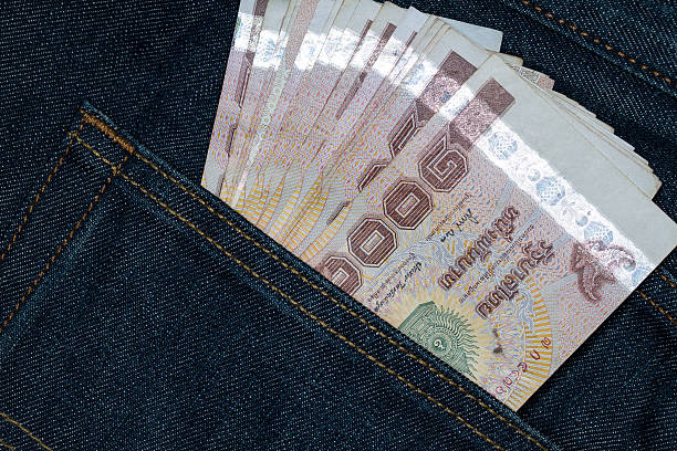 istock Thai banknotes in a back pocket of a denim jean 545437606