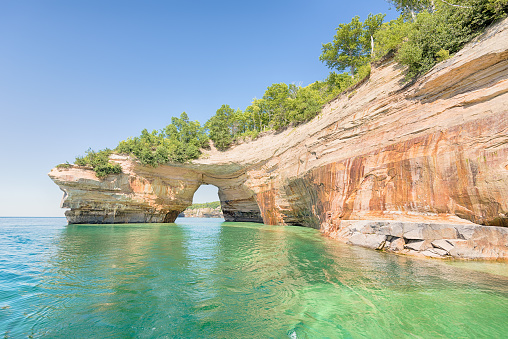 Lovers Leap, a named formation on Lake Superior in Pictured Rocks National Lakeshore, near Munising, Michigan. Mineral seepage creates the colors: Red and orange are iron, green and blue are copper, black is manganese, and white is lime.