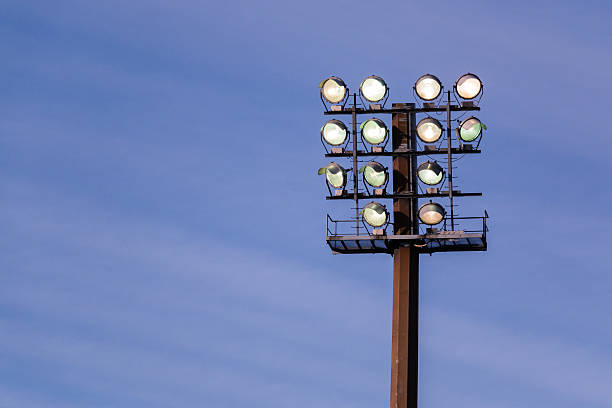 istock Large floodlight stand against the blue sky 545439800