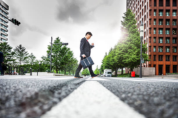 istock Business man crossing the street 545441330