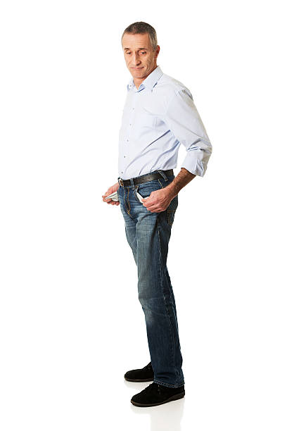 istock Full length confused man showing his empty pockets 545442596