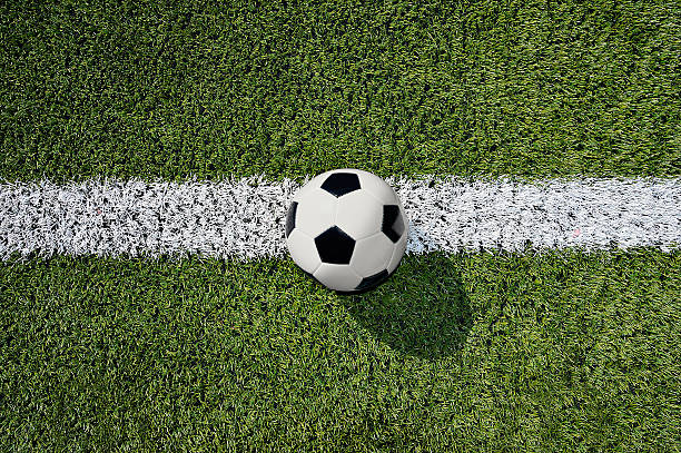 istock soccer ball on soccer field 545444158