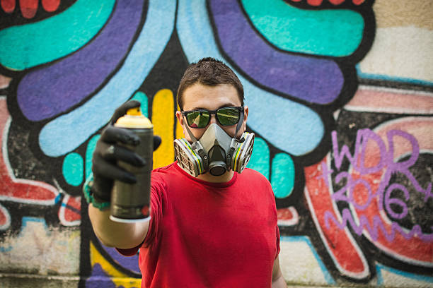 istock Graffiti artist holding spray color can 545444380