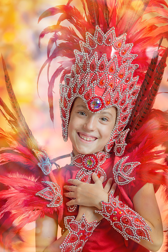 Cute little 8 years old girl in Carnival costume dancing Samba