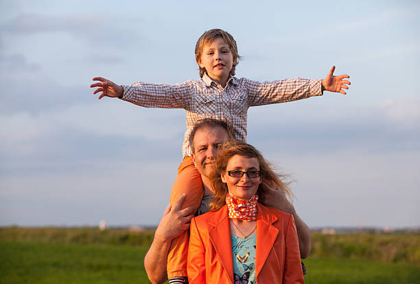 istock Happy family: father, mother and son have fun outdoor 545447154