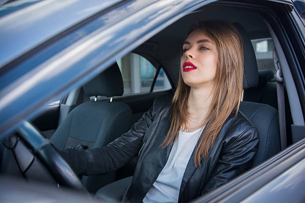 istock Pretty female driver riding a car 545447804