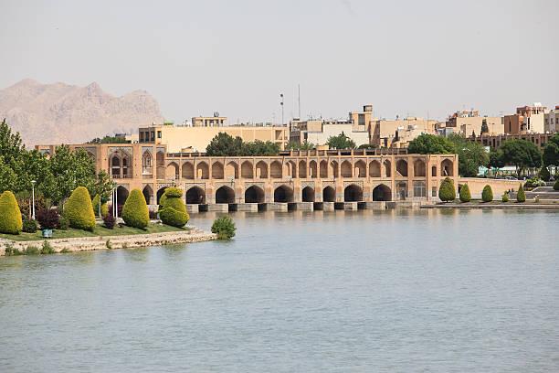 Isfahan, Iran - March 24, 2010:  Si-o-Se-pol (Thirty three spans) bridge with Haft Sin table, arrangement of seven symbolic items that is traditionally displayed at Nowruz, the Iranian new year.