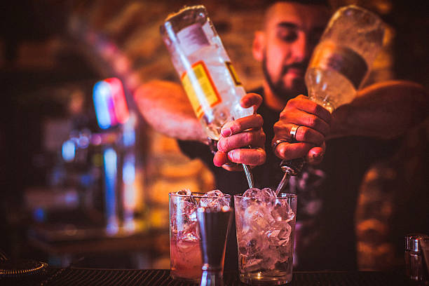 istock Midsection of young bartender preparing cocktails in nightlife bar 545450738