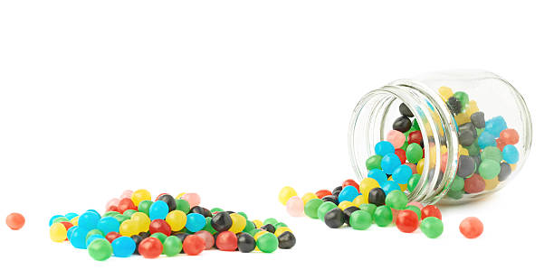 istock Candy ball sweets falling out of a jar 545451384