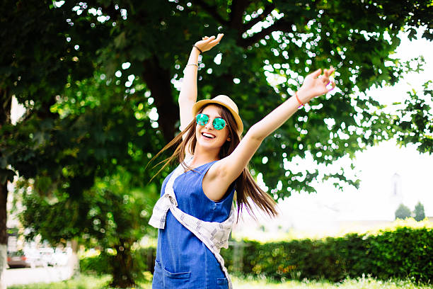 istock Happy  glory sunny girl in park 545453486