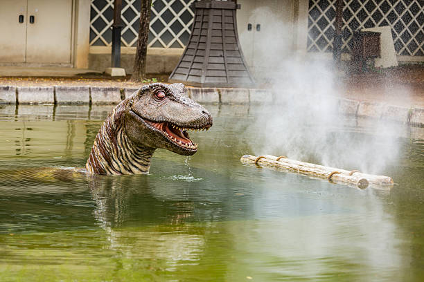istock Dinosaur Like Beast Rising From The Water 545453890