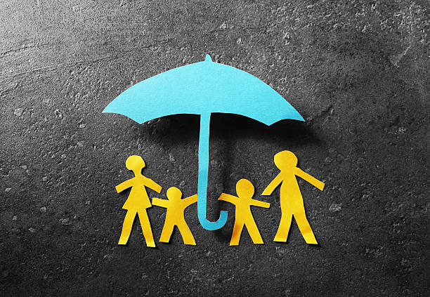 istock Paper family under umbrella 545456598