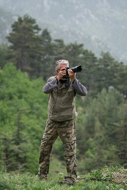 istock Photographer taking pictures in nature 545456626