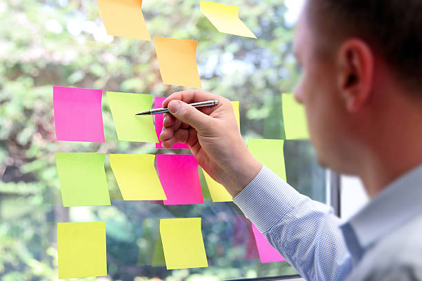 istock business man  working  with  stickers in office 545457248