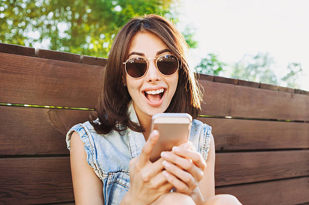 istock Happy girl using smart phone 545458228