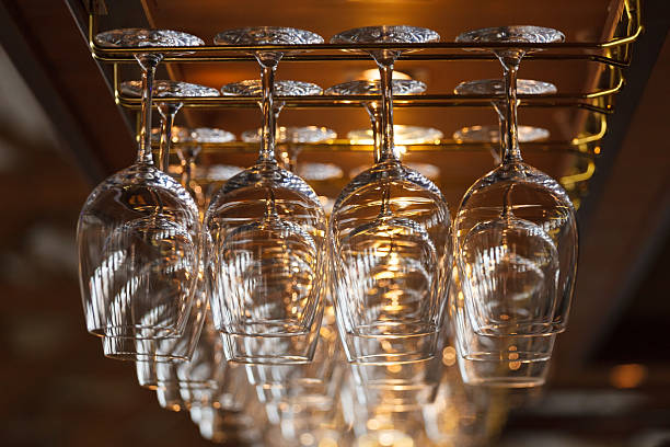 istock different glasses hanging over the bar. Soft focus. 545459530