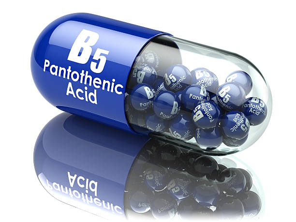 istock Vitamin B5 capsule. Pill with pantothenic acid. Dietary suppleme 545459772