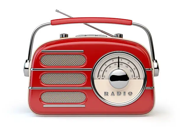 Photo of Red vintage retro radio receiver isolated on white.