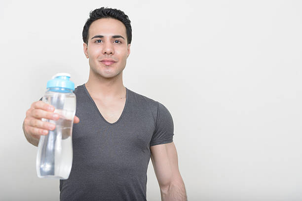 istock Studio shot of handsome muscular man holding water bottle 545460806