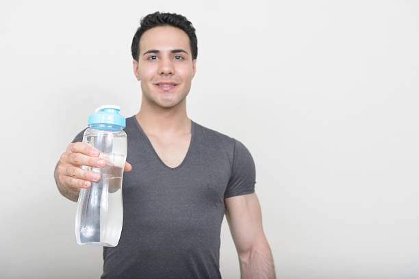 istock Studio shot of handsome muscular man holding water bottle 545460874