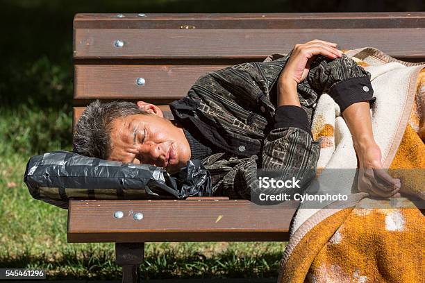 Homeless Woman Sleeping On A Bench Stock Photo - Download Image Now - Abandoned, Absence, Adult