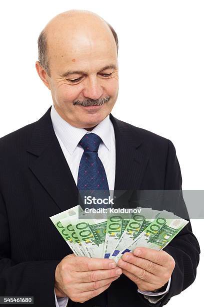 Elderly Man Counts Money Stock Photo - Download Image Now - Adult, Adults Only, Balding