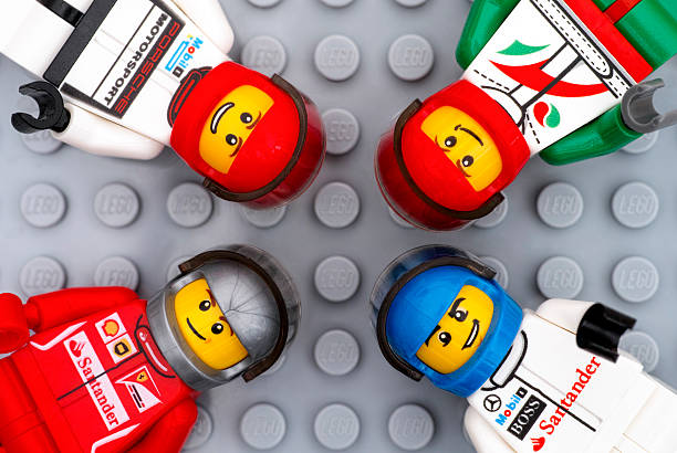 Tambov, Russian Federation - July 06, 2016: Four Lego driver minifigures on Lego gray baseplate background. Studio shot.