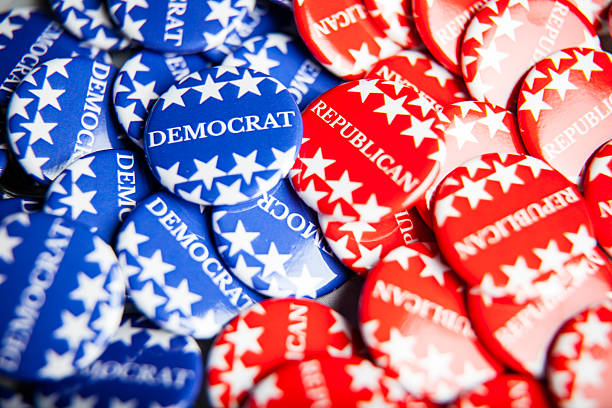 Election Vote Buttons Close up of Vote election buttons, with red, white, blue and stars and stripes. Democrats and Republicans democratic party usa stock pictures, royalty-free photos & images
