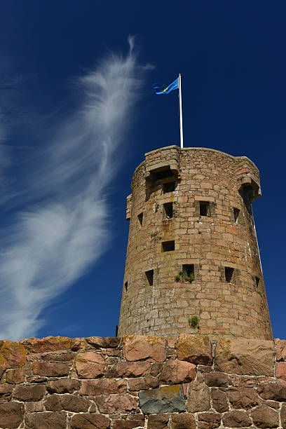 Telephoto image of an uninhabited Napoleonic Wars tower built by the shore in the 19th century.