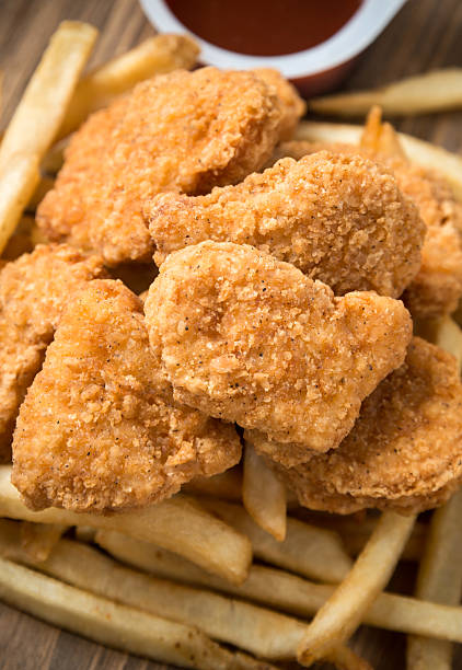 istock Chicken Nuggets with french fries 545548326