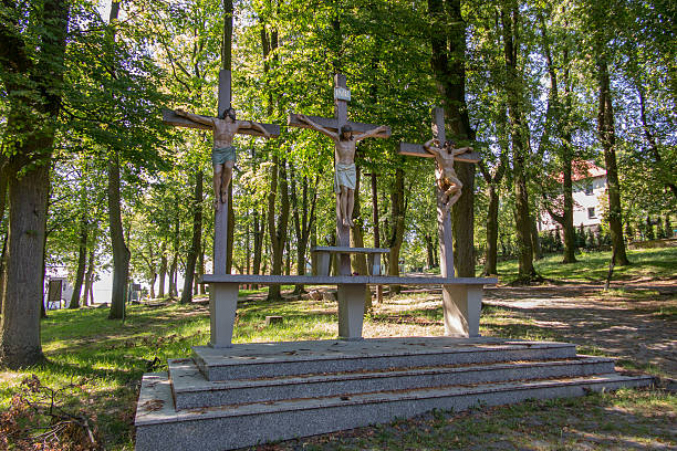 Crosses Jesus and the two thieves on Calvary. International Shri Crosses Jesus and the two thieves on Calvary. International Shrine of St. Anne, Mount St. Anna, Poland kneelers stock pictures, royalty-free photos & images