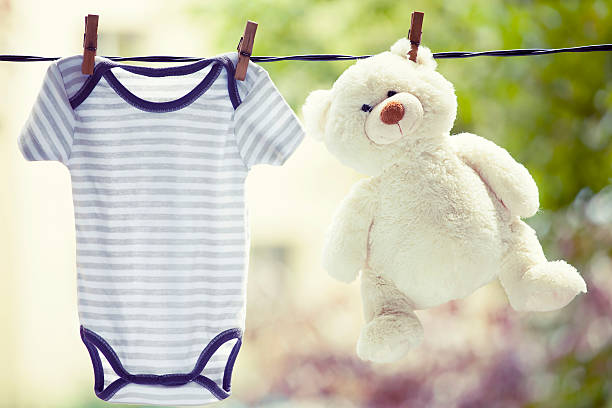istock Baby clothes hanging on the clothesline 545550632