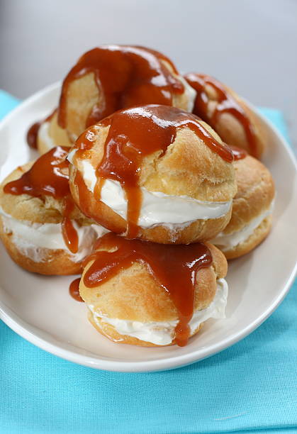 istock Profiteroles with cream caramel sauce 545550796
