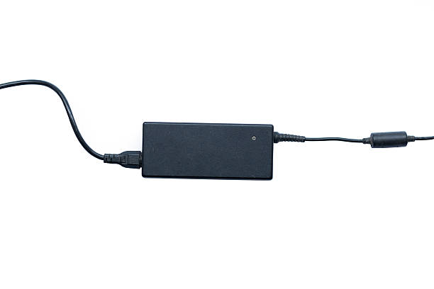 istock Laptop charger adapter isolated on white background 545551956