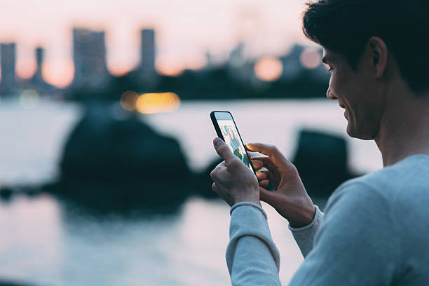 istock Young japanese man texting on the phone 545553320