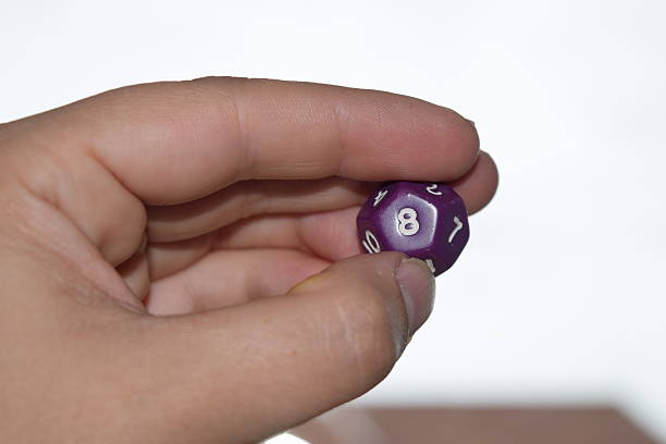 istock holding vitual 12 sided role playing game dice numbers background 545553570