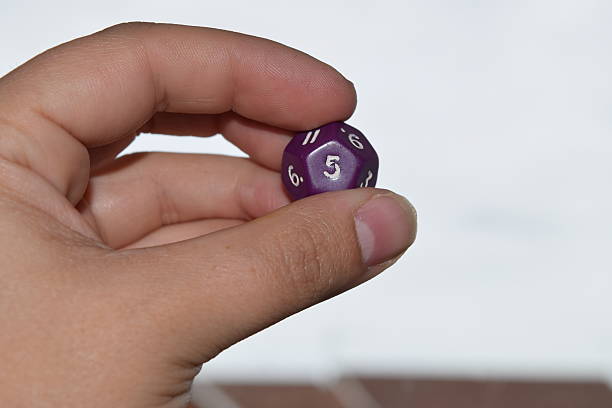 istock holding vitual 12 sided role playing game dice numbers background 545553574