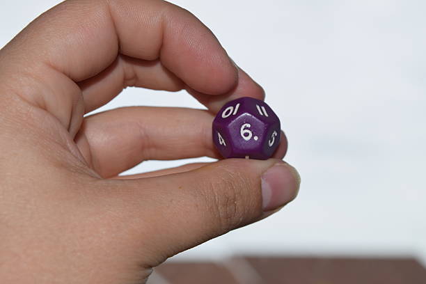 istock holding vitual 12 sided role playing game dice numbers background 545553576