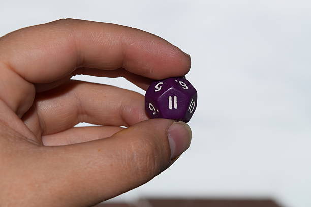 istock holding vitual 12 sided role playing game dice numbers background 545553578
